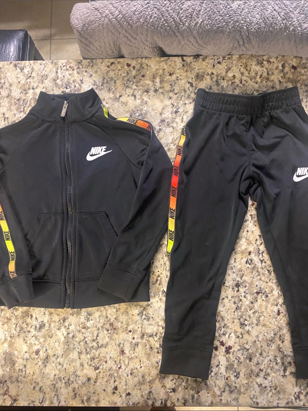 Nike Black Kids Jogger Set with Yellow-Orange Gradient Logo Tape